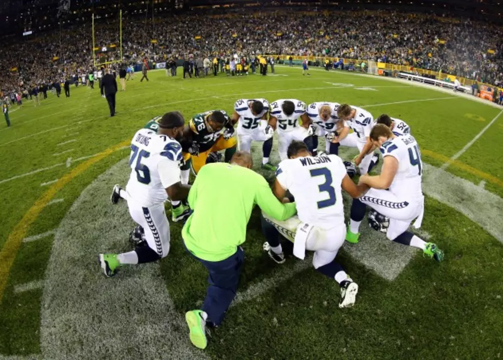 Washington Coach Prays After Football Game, Defying Orders