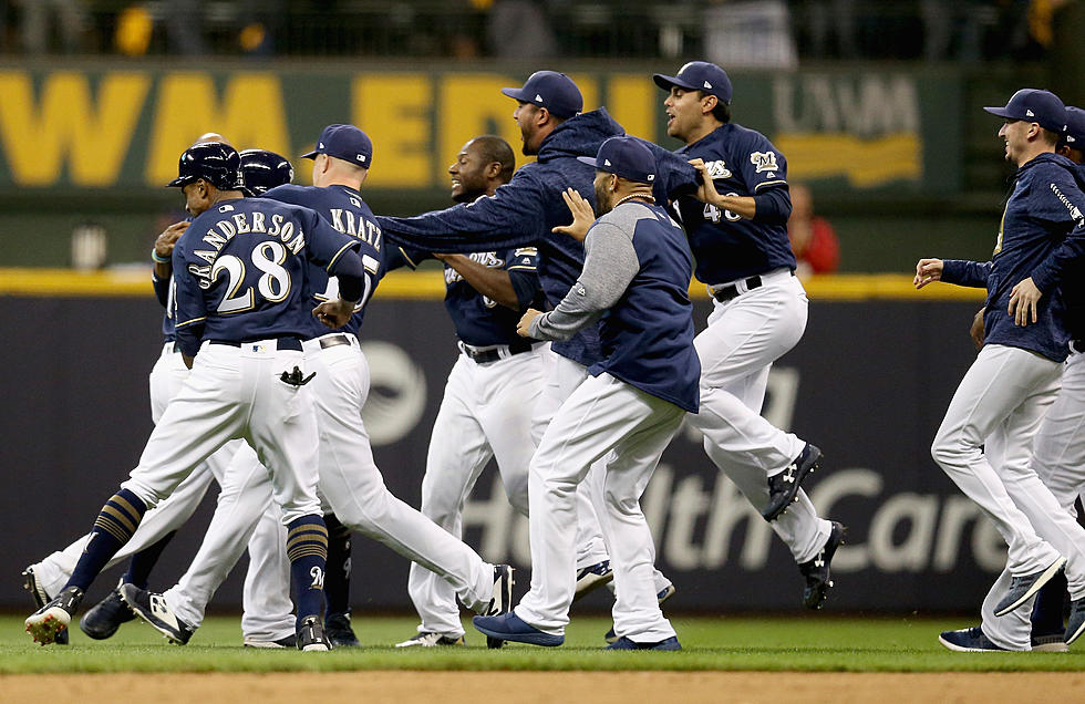 Moustakas Scores Yelich in 10th, Brewers Top Rox in Opener