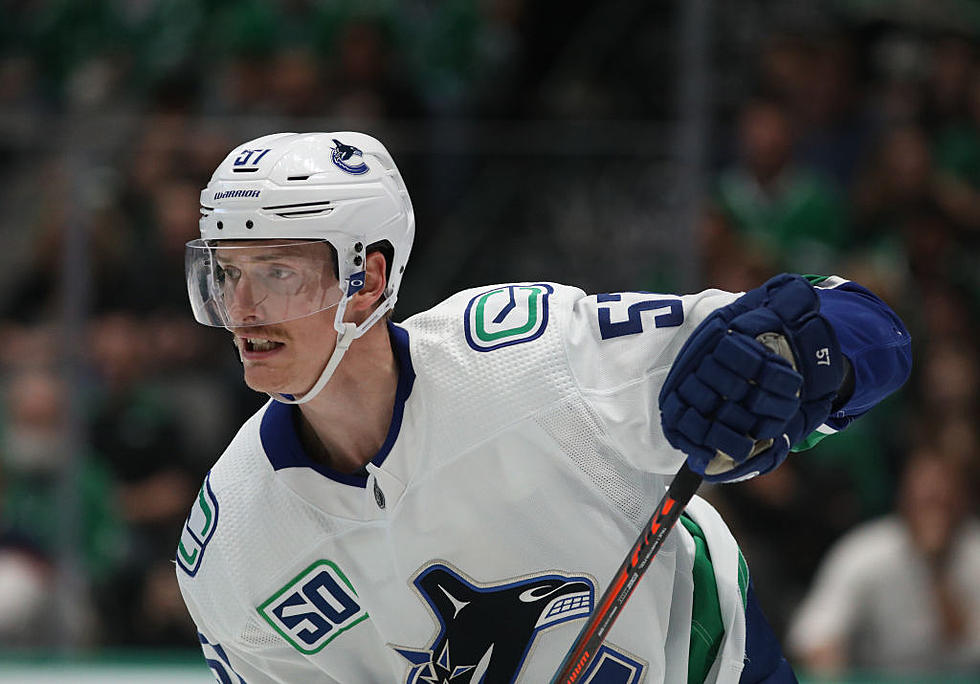 Myers has 2 goals, Assist to Help Canucks Beat Flames 5-2