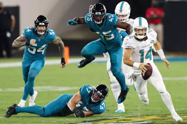 Dolphins Thump Jags for First Win