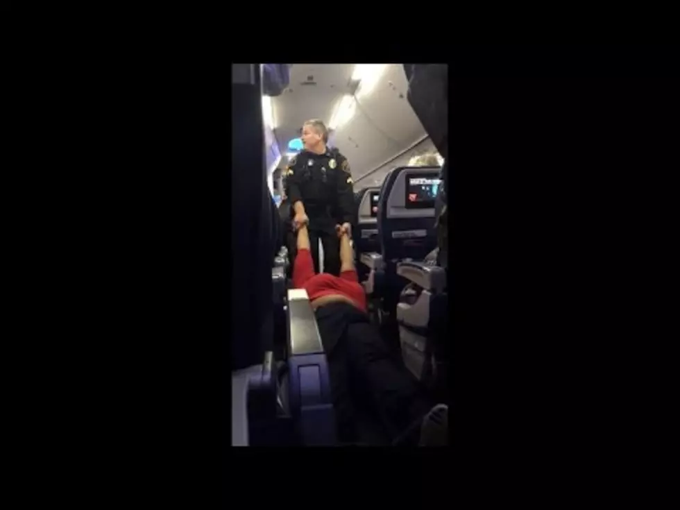 Woman Dragged off Plane in Detroit