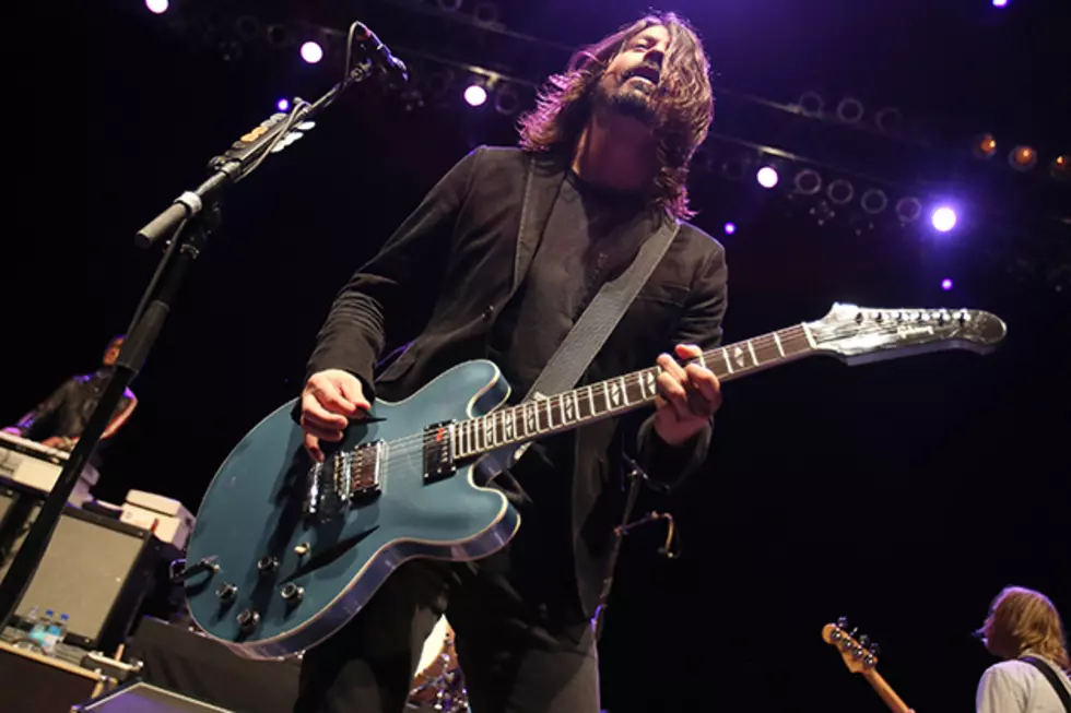 Dave Grohl Does Awesome Rock-Star Stuff on Top of a Bar