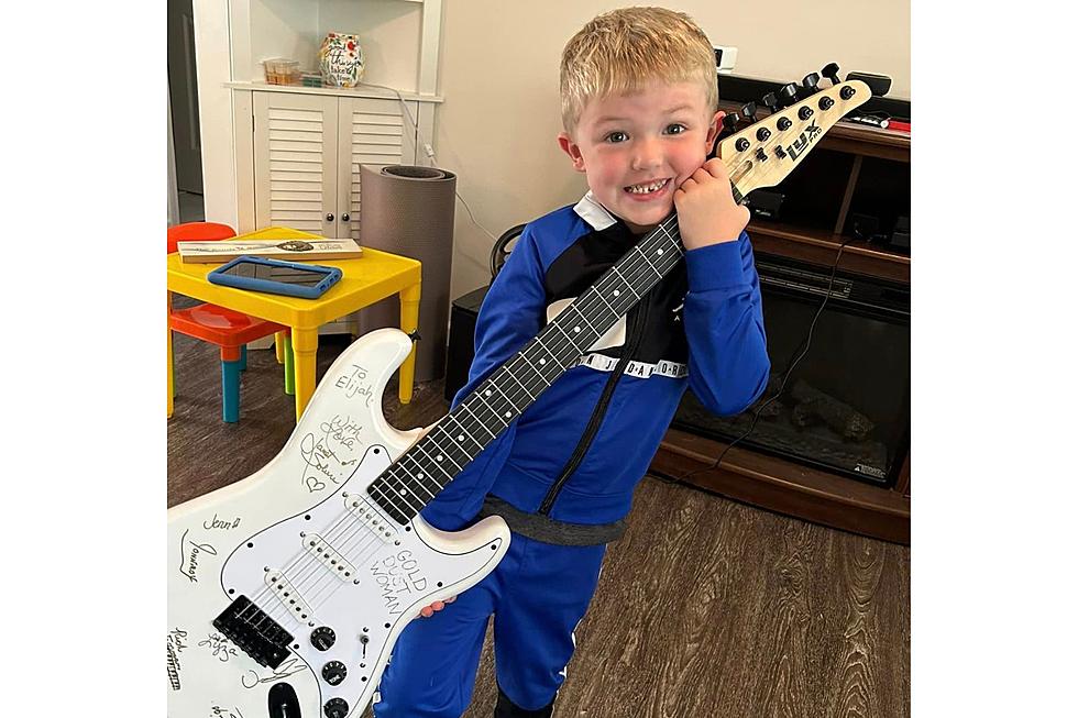 Oneonta, New York Boy Receives Autographed Rock and Roll Guitar