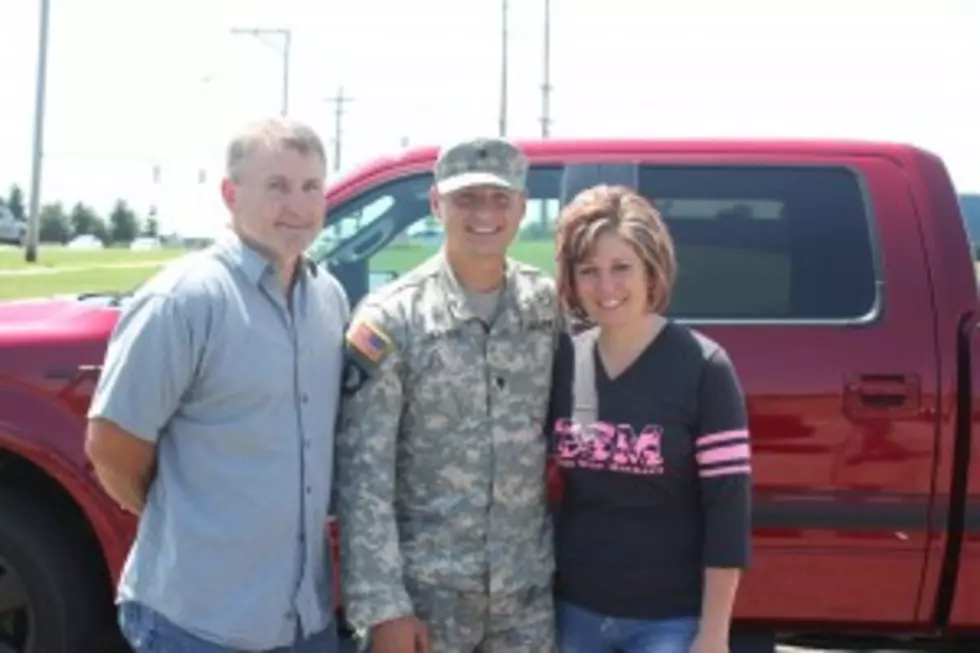 U.S. Army Spec. Mitchell Oliver shares time with his parents, Gary and Deann Oliver, of Greenville, in front of the Ford F-150 pickup truck he has as a loaner ride from Ed Koehn Automotive Group through the Fly A Soldier Home This Summer contest won by his mom's 98.7 WFGR entry. (Photo: Niki Bloem)