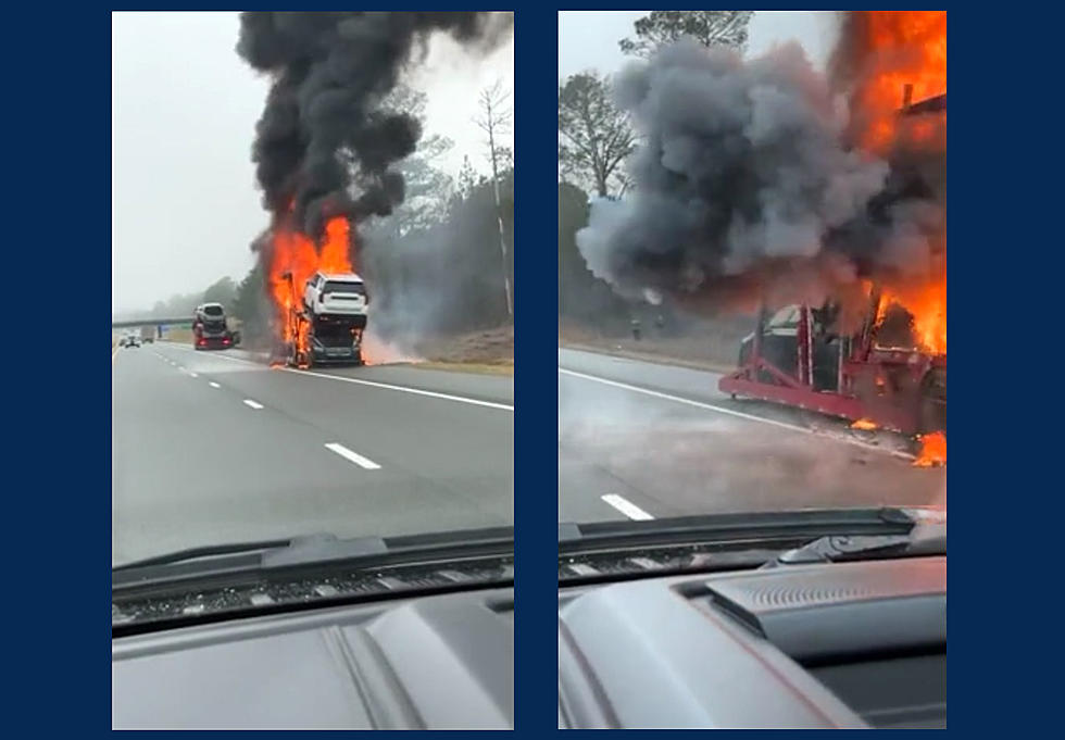 Driver Goes By Car Carrier on Fire, Tire Explodes as He Drives By