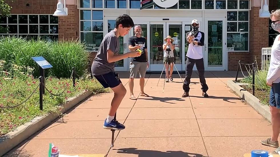 Teen Attempts Record For Solving Rubik’s Cube While On Pogo Stick