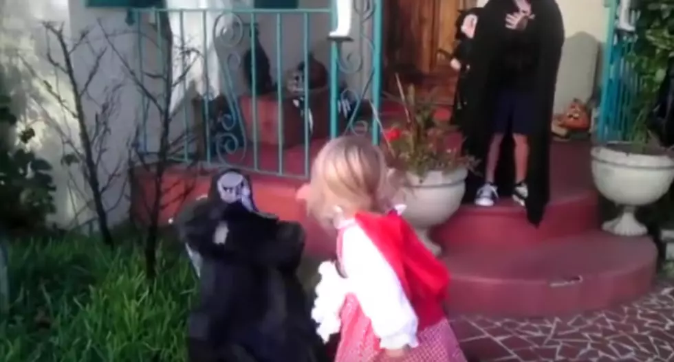 Little Girl Protects Big Brother from Scary Halloween Decoration [VIDEO]