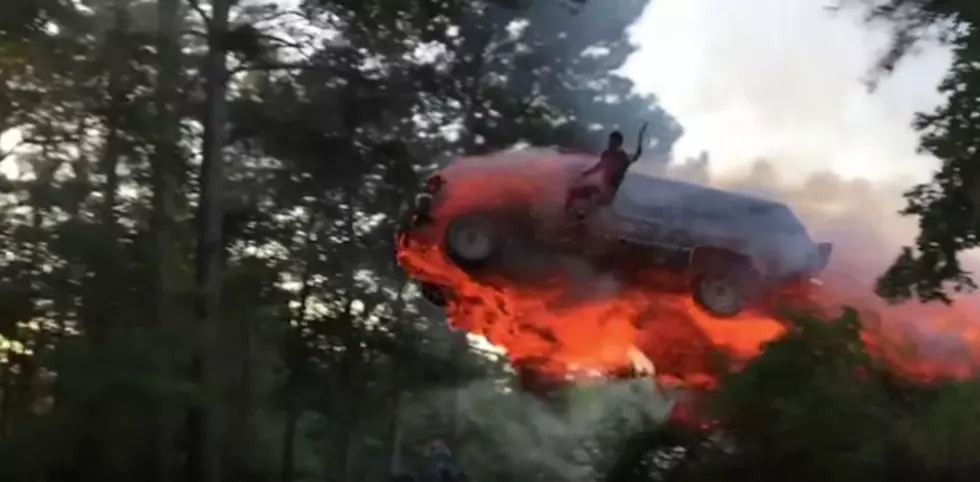 Watch a Dude Start His SUV on Fire and Jump it Into a Lake &#8211; On Purpose