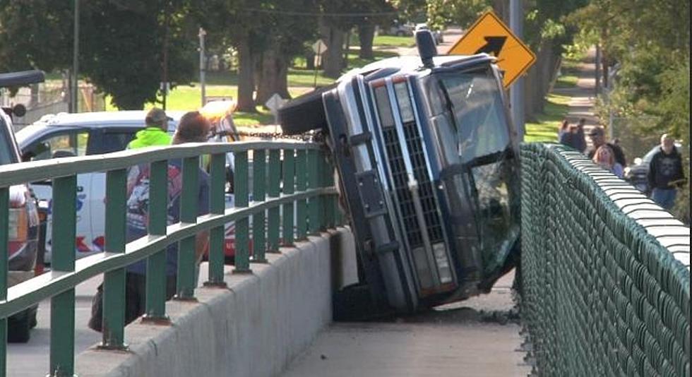 Rollover Crash in Sioux Falls Wedges Vehicle in Bridge Walkway