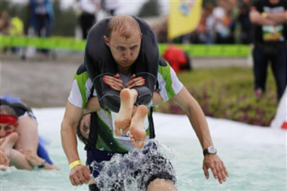 Win Your Wife’s Wt. In Beer – Enter The Wife Carrying Championship