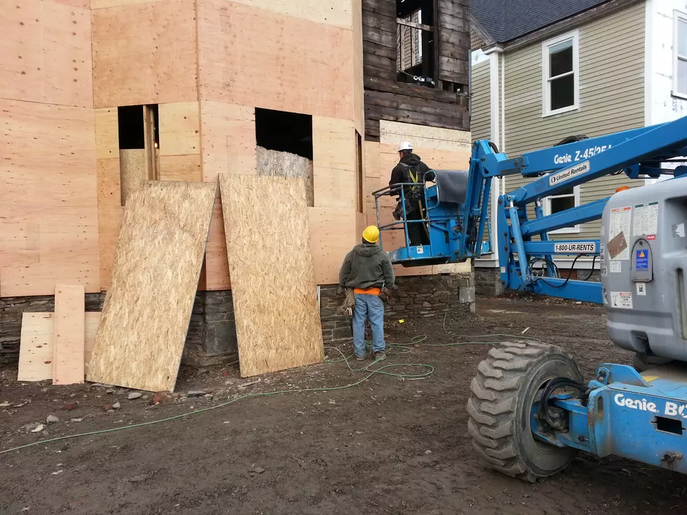 Workers remodeling a Front Street apartment building. (Bob Joseph/WNBF News)