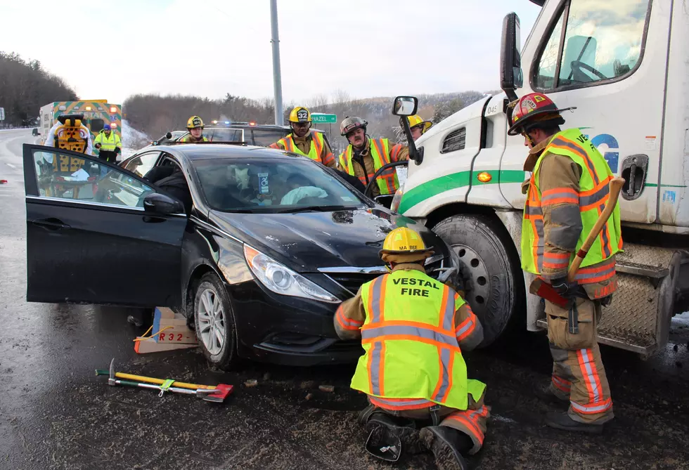 Firefighters working to remove an injured woman from a car on Route 26. (Photo: Bob Joseph/WNBF News)