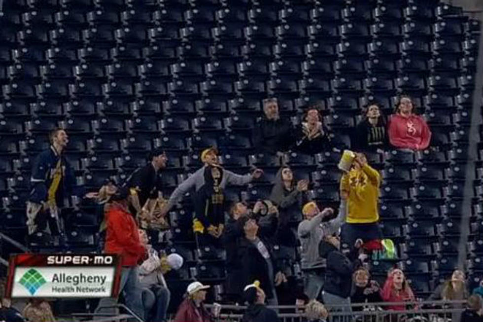 Fan Catches Foul Ball in Tub of Popcorn [VIDEO]