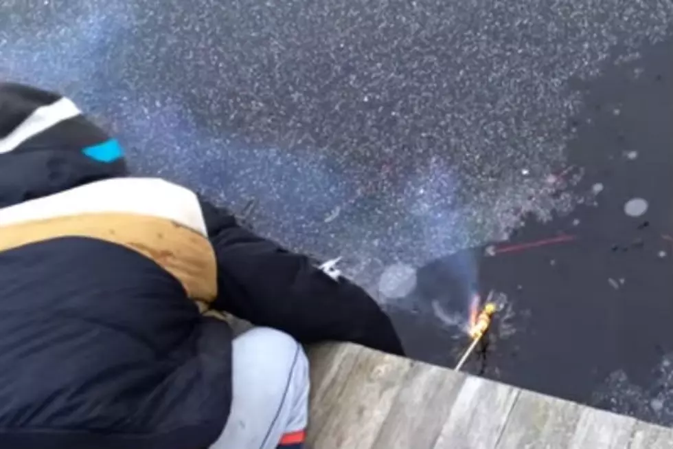 Shooting a Bottle Rocket Underneath the Ice of a Frozen Lake is Awesome [VIDEO]