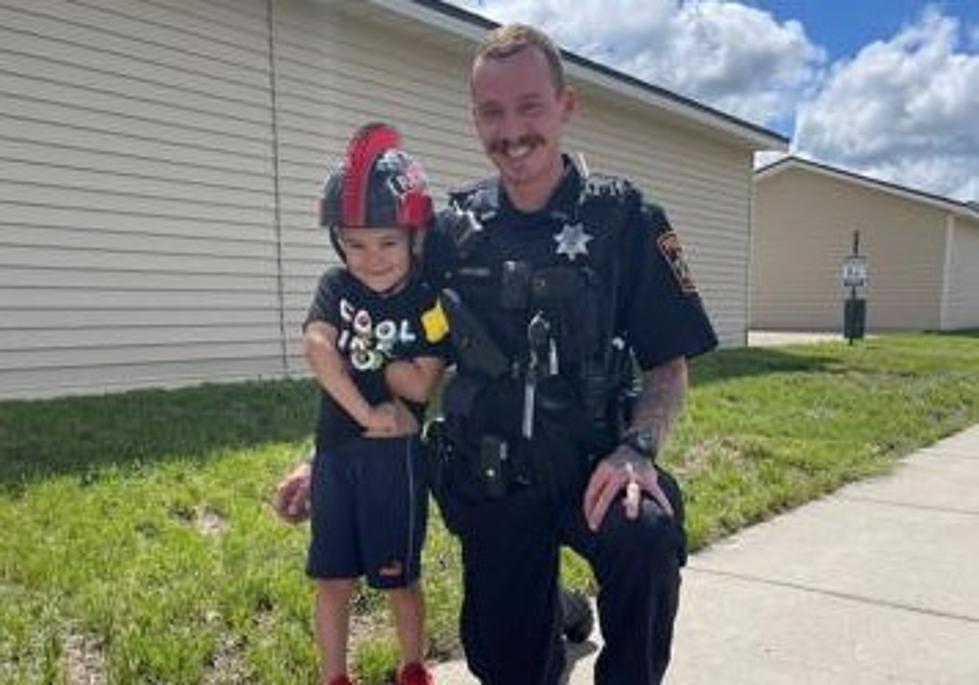 Williston Police Officer "Throws The Book" At A Smiling Young Boy