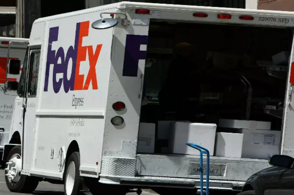 Fed Ex Truck Travels down Highway with Back Door Open and Packages Flying out [VIDEO]