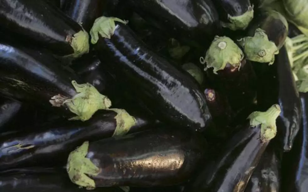 Man Cuts Open Eggplant-Seeds Spell God