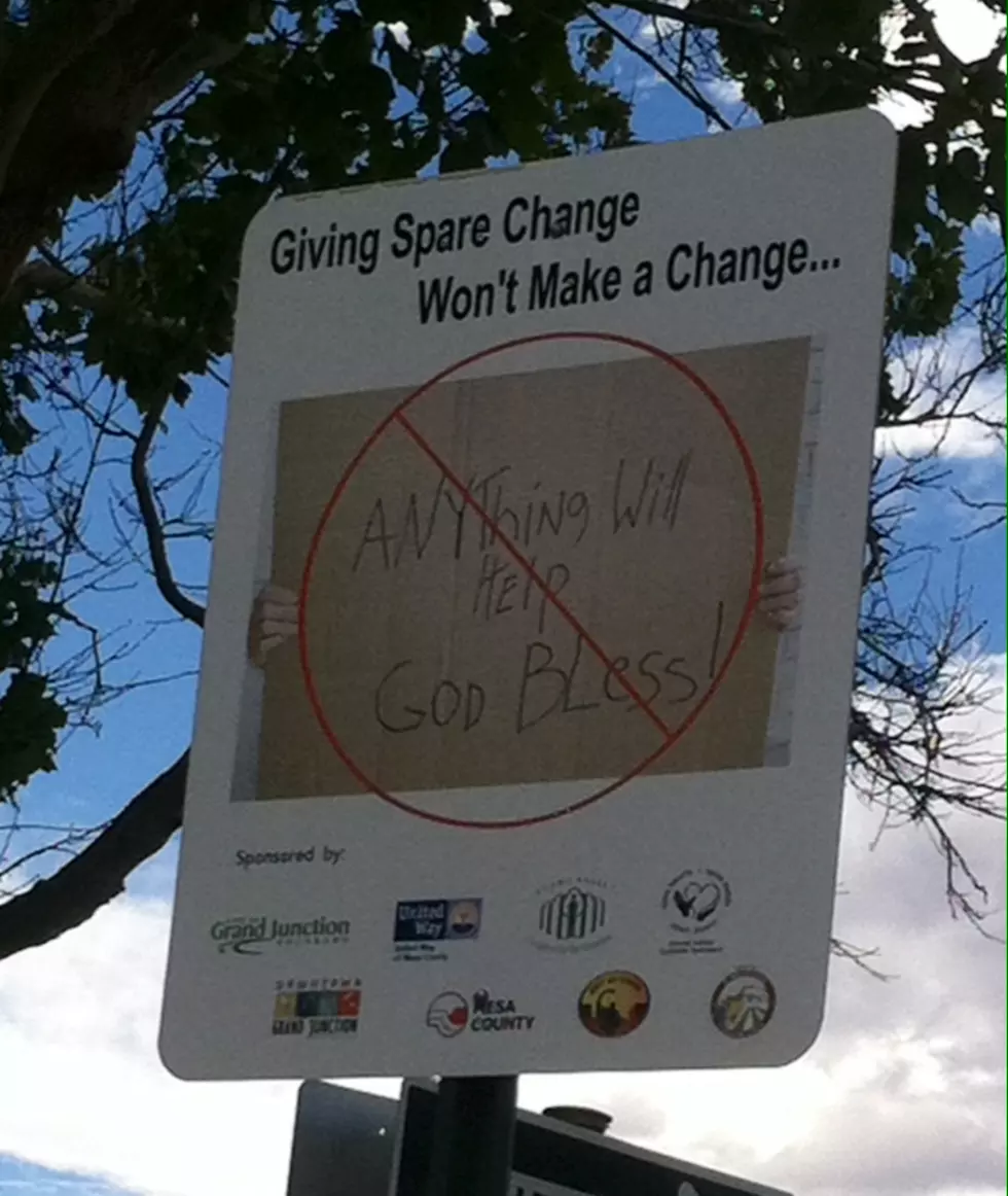 What’s With The “Giving Spare Change…” Sign?