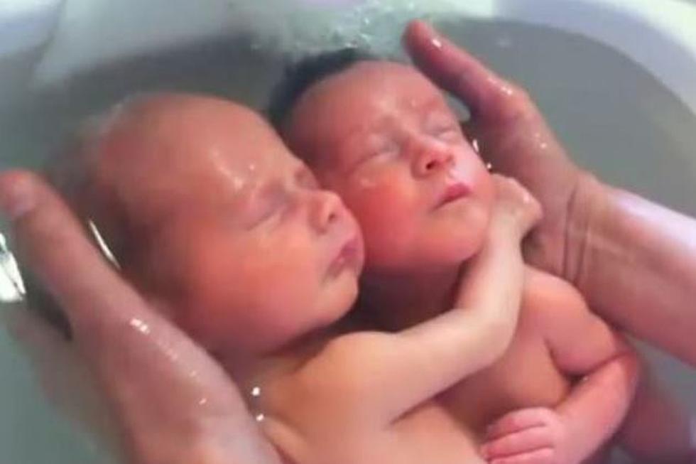 Watch as a Warm Bath Takes Newborn Twins Back to the Beginning