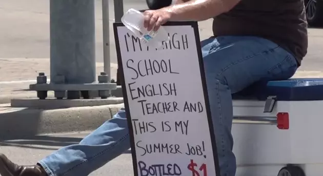 Local Teacher Sells Water Bottles At Intersection For Extra Summer Cash