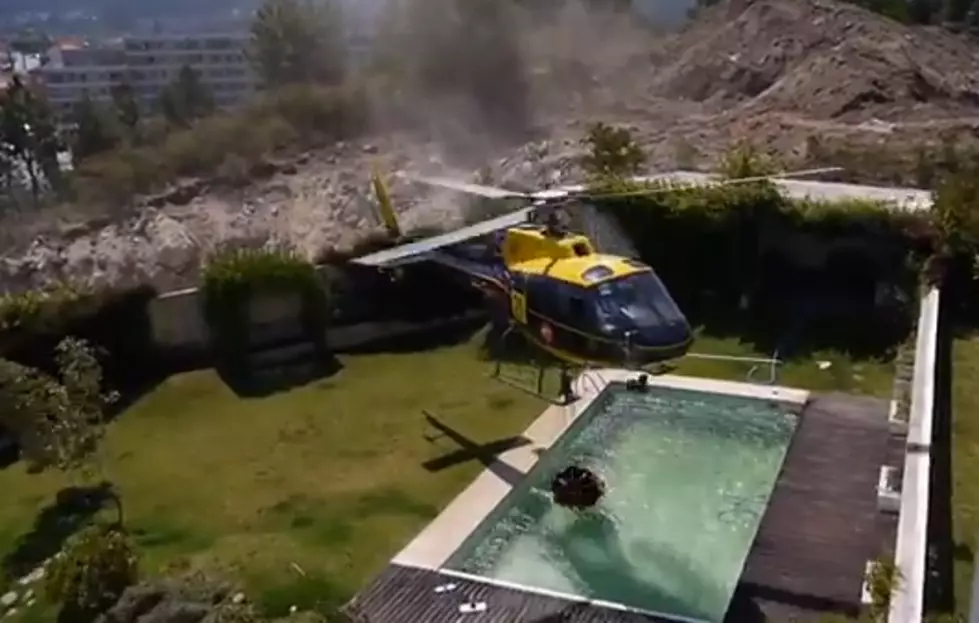 Helicopter Borrows Pool Water to Put Out Fire [Video]
