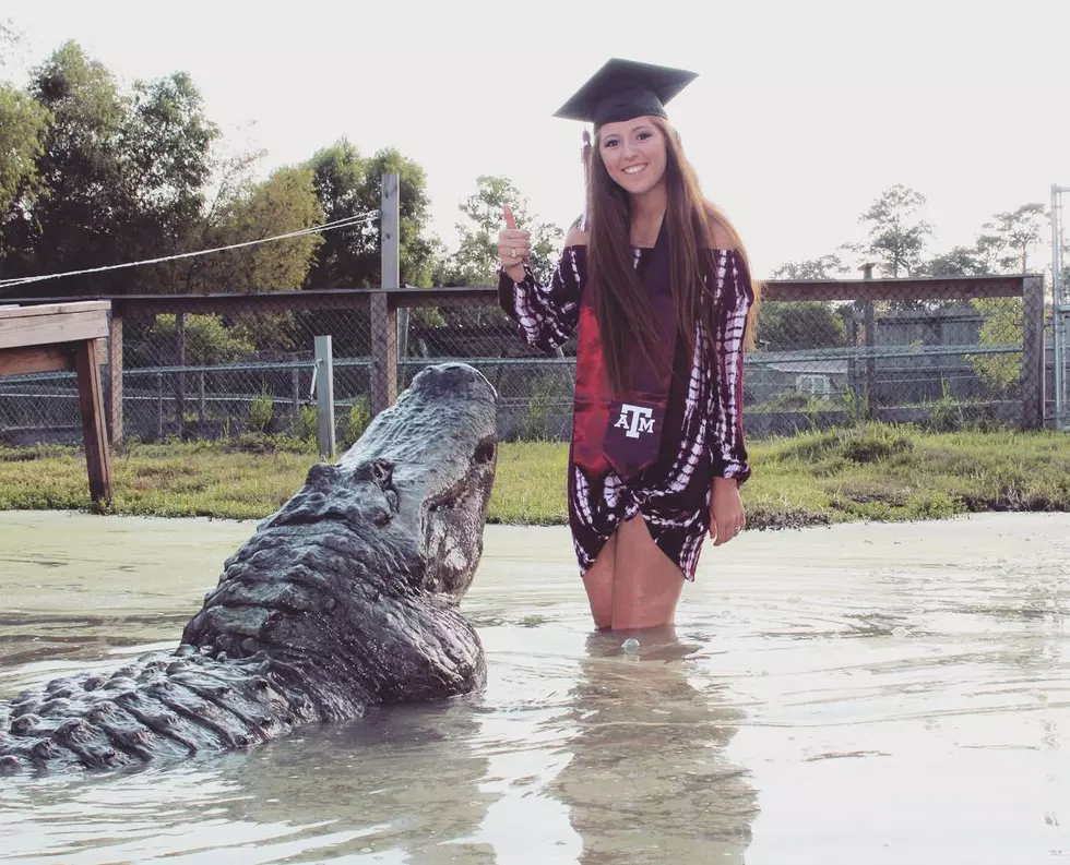 Aggie Poses with Big Tex Gator for Graduation Photo