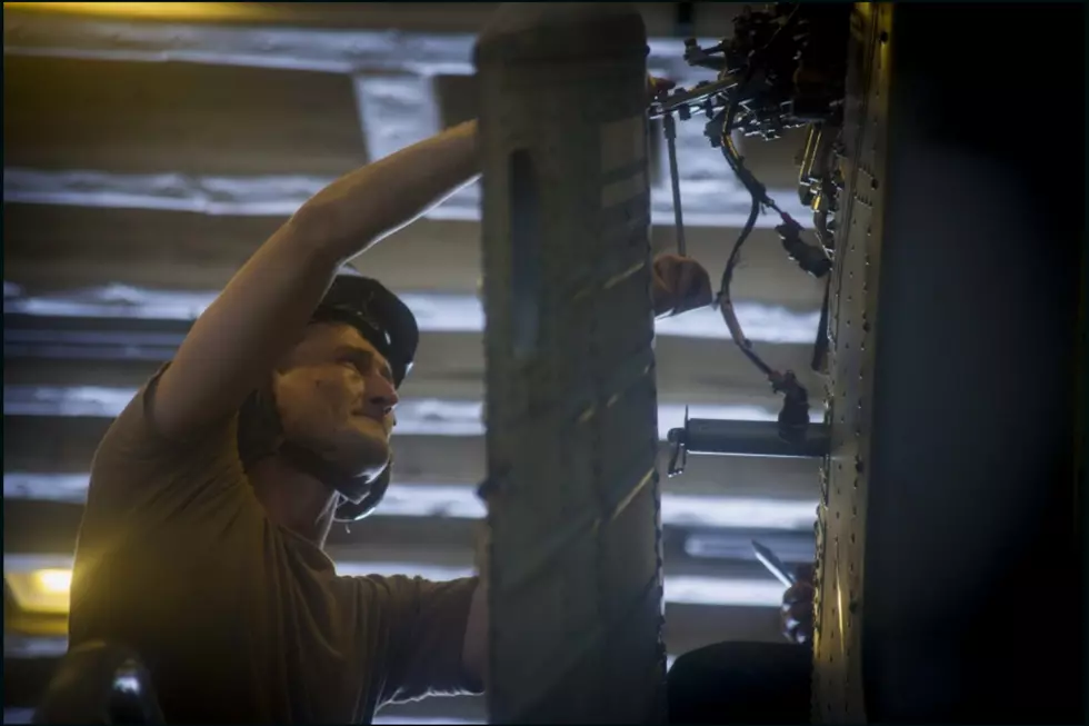 Temple Native Photographed Serving Aboard USS America