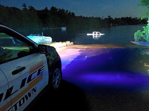 Truck, Boat, And Driver Fall Into Freetown Pond