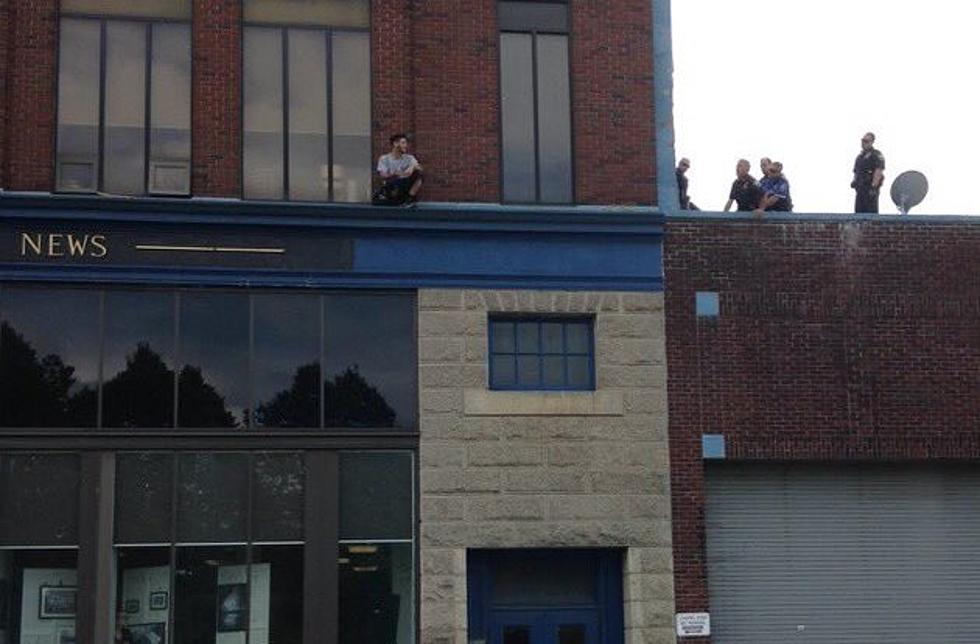 Man Pulled From Ledge Of Herald News Building