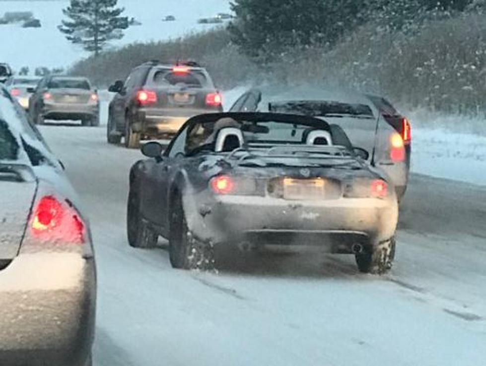 Guy Drives Through Snow in Convertible&#8230; WITH TOP DOWN!!