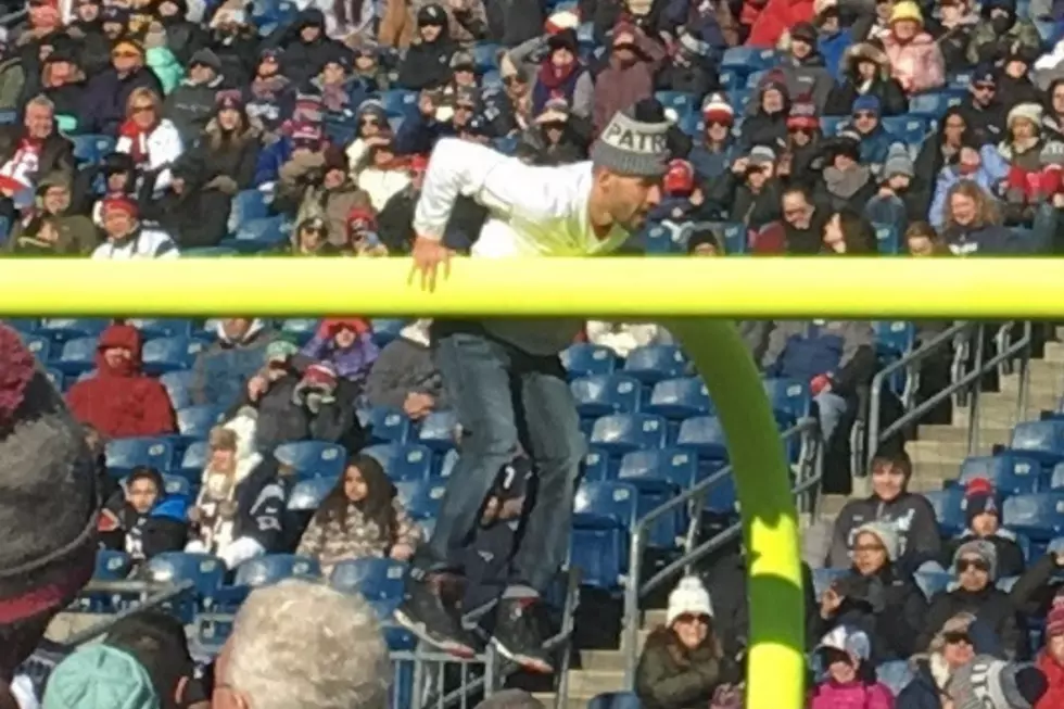 Unruly Patriots Fan Climbs Goal Post, Gets Ejected from Sendoff Rally
