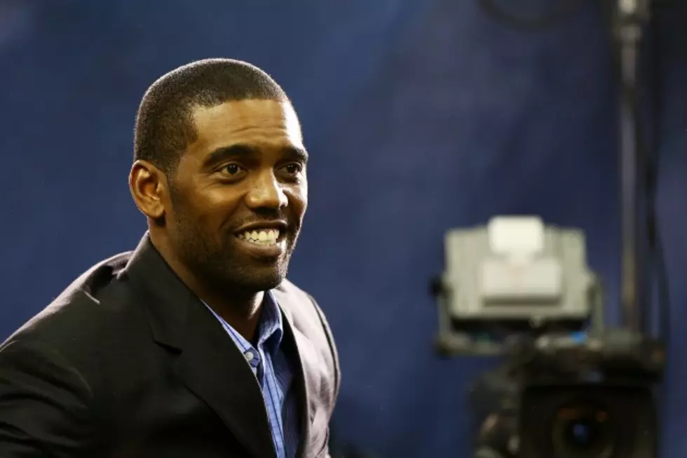 Randy Moss Hands Diploma to Longtime Young Friend