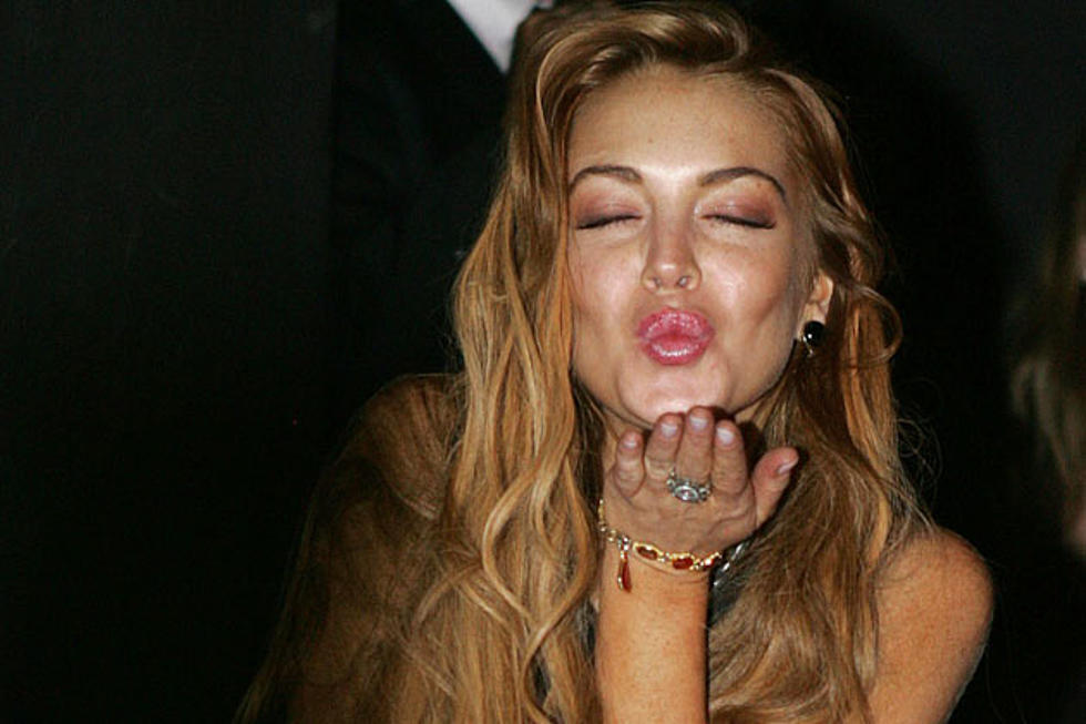 Lindsay Lohan Is Spending Her Time in Brazil Earning Money and Hiding Under Tables [PHOTOS]