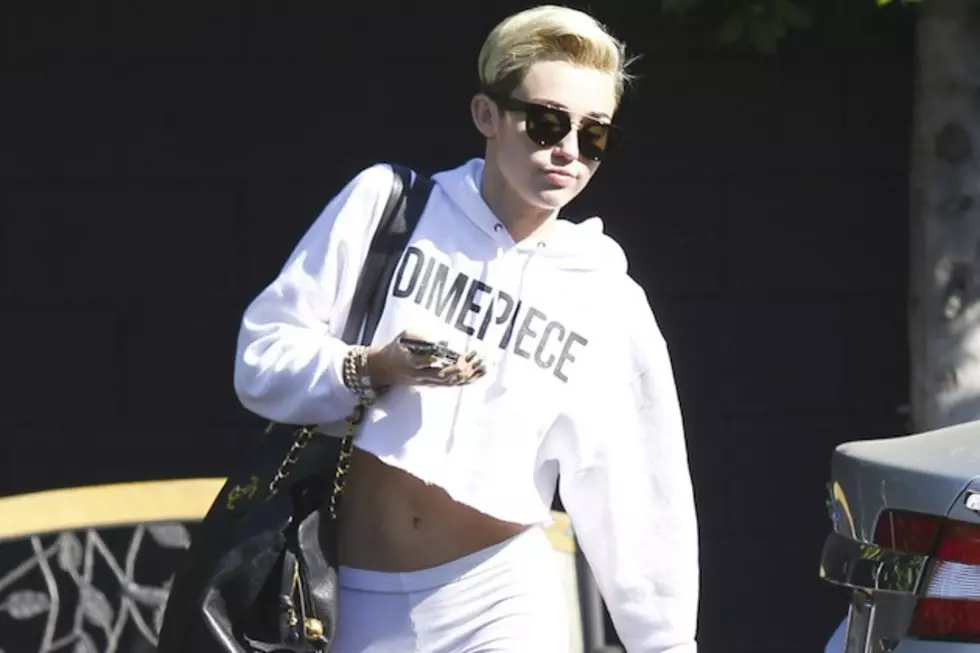 Miley Cyrus Made Out With a Giant Baby in Efforts to Quench Her Endless Thirst [PHOTO]