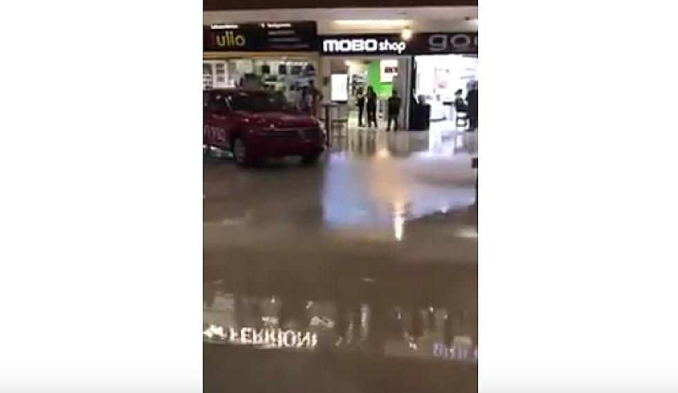 As Mall Floods, Band Plays Song from "Titanic"