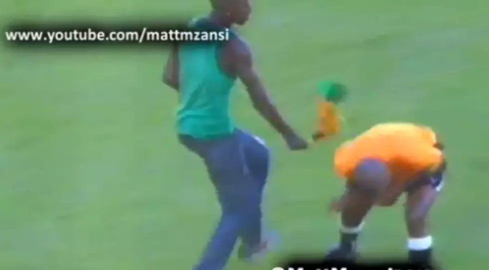Fan Runs Onto Field, Attacks Soccer Ref with Vuvuzela [VIDEO]