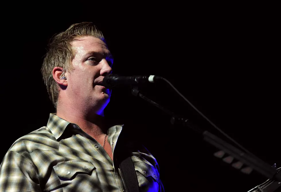 Watch Queens Of The Stone Age Singer Politely Throw Fan Off Stage
