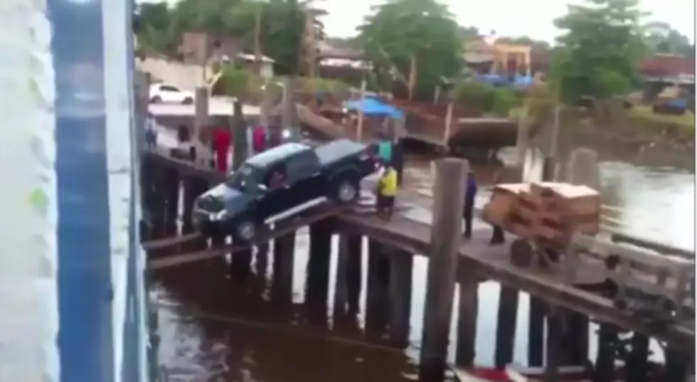 Truck Defies Odds By Boarding Boat on Flimsy Wooden Planks
