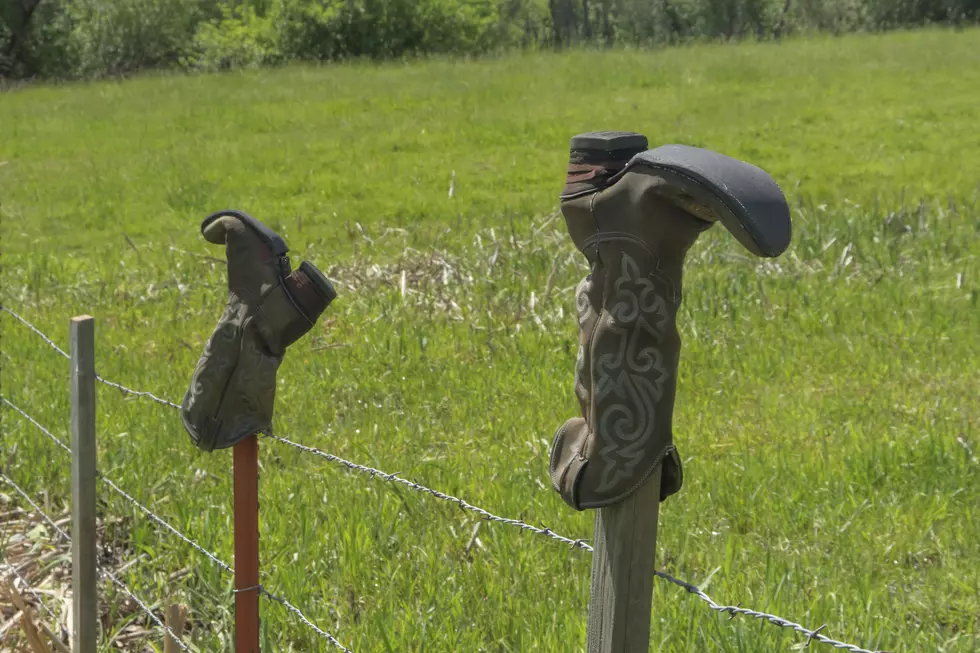 The Secret Meaning Behind Putting Boots On A Texas Fence
