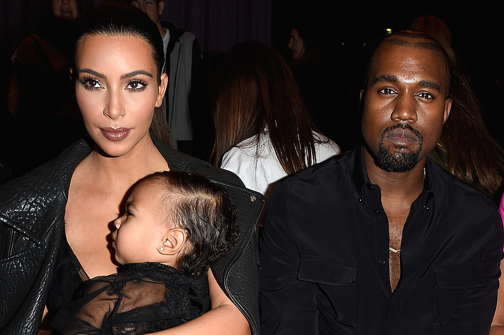 Kanye West Grabs Handful of Kim Kardashian’s Assets [PHOTO]