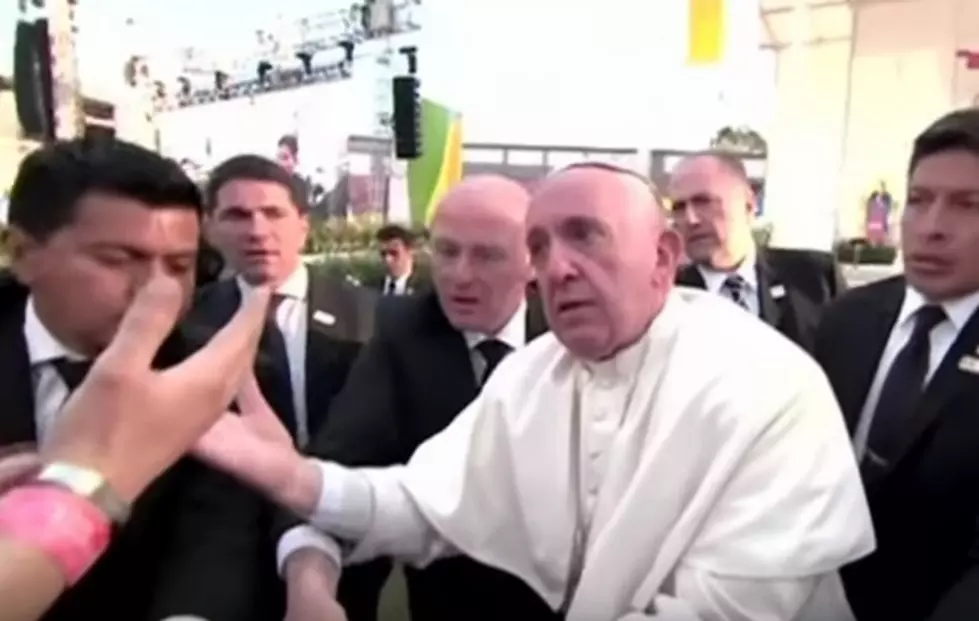 Watch Pope Francis Get Pulled down and Lose His Temper