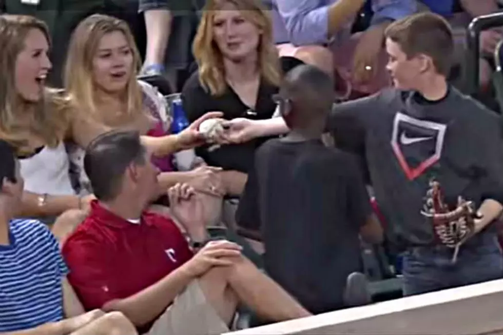 Kid Pulls A Fast One On Pretty Girl At Baseball Game [VIDEO]