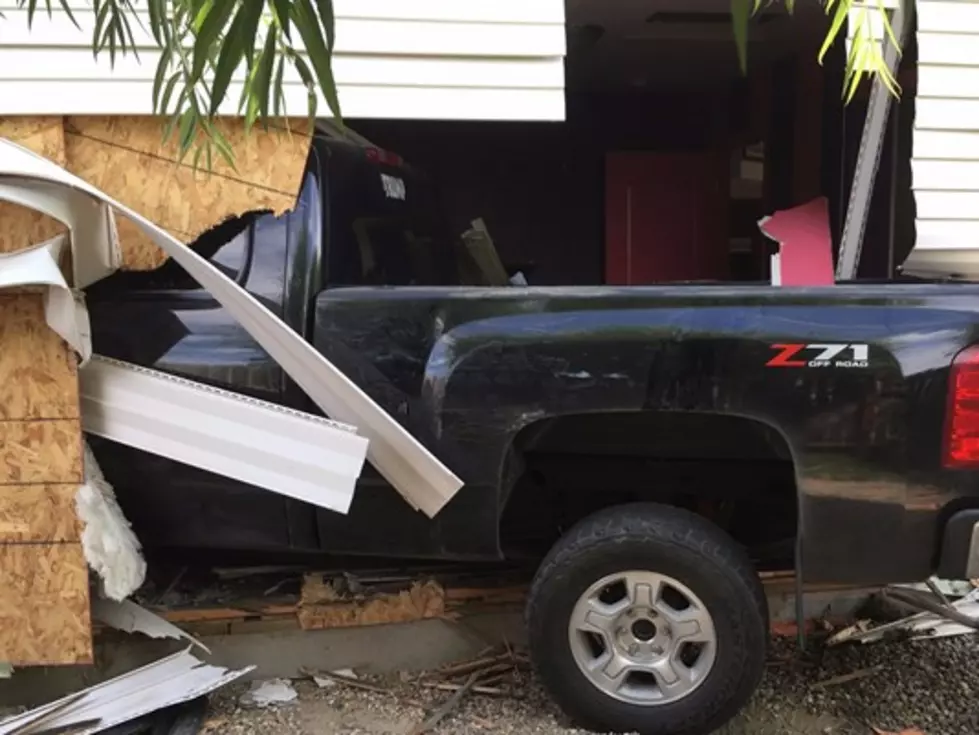 Teen Drives Into Home