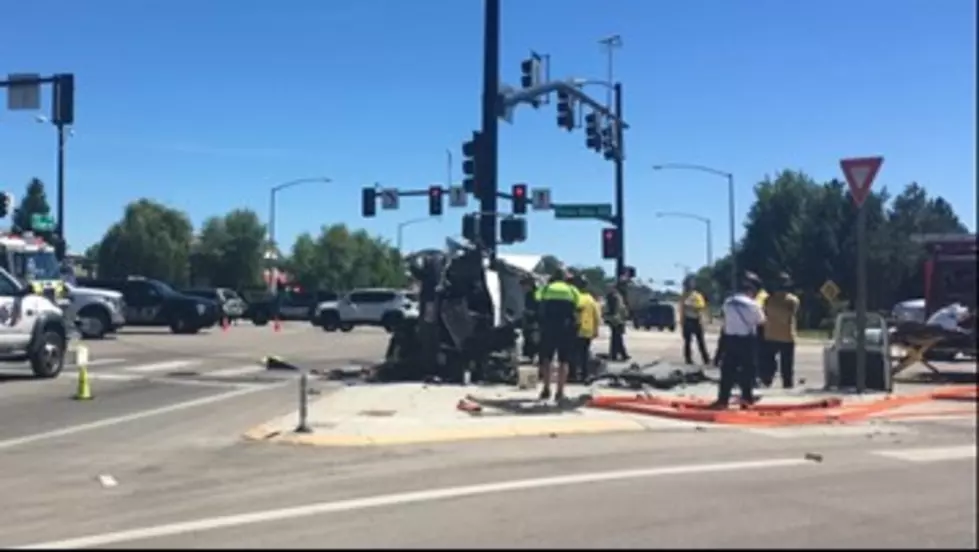Van Pinned To Traffic Light Pole at Eagle Road and Highway 44