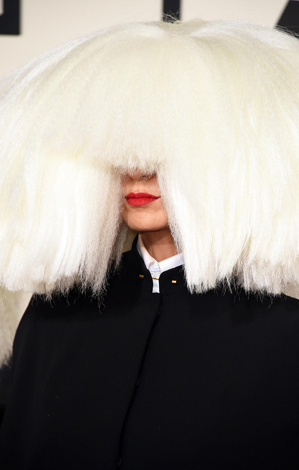 Why Does Sia Hide Her Face?