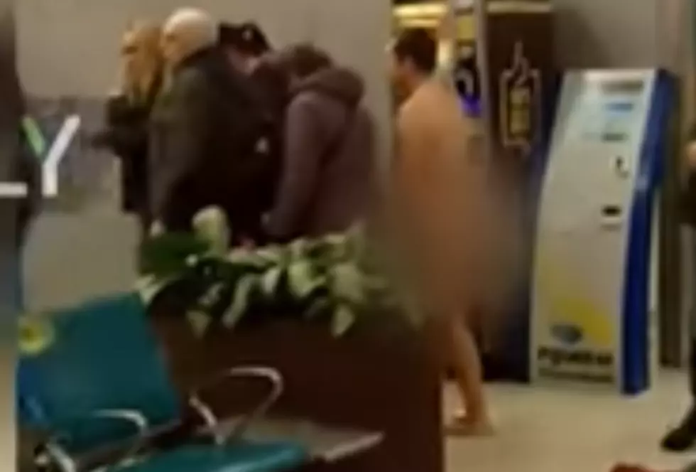 Naked Man Attempts to Board Plane (video)