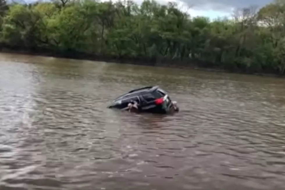 A Woman Is Saved From A Sinking SUV