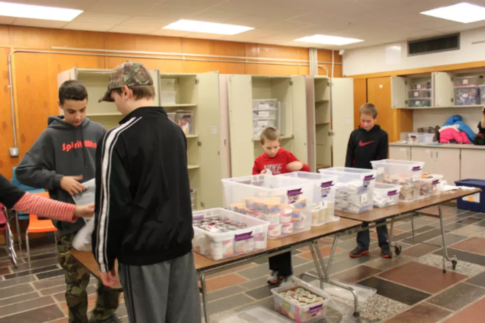 Volunteers Giving Meal Packs to ROCORI Students in Need [AUDIO]