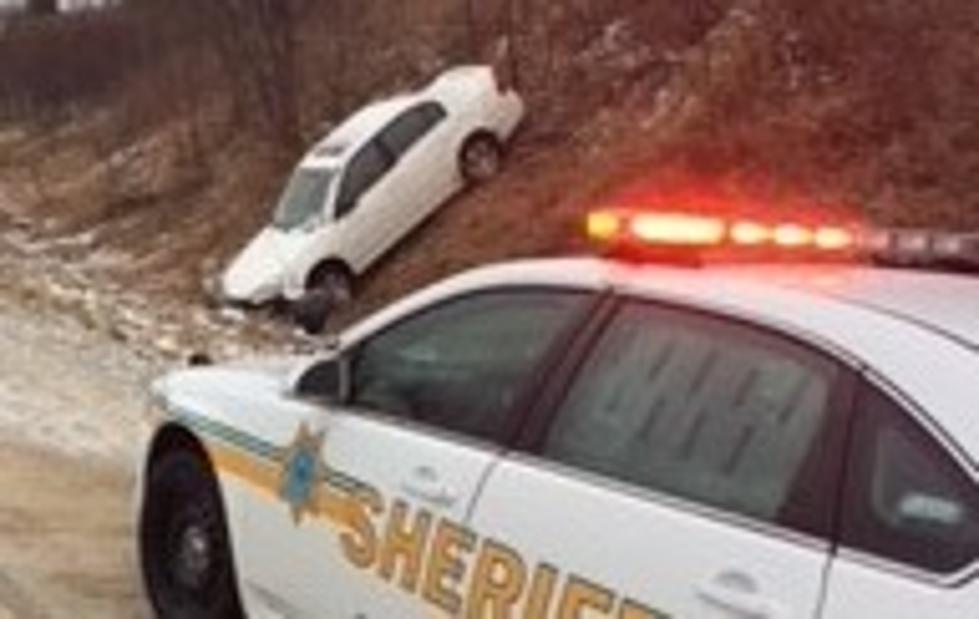 New Snow, Makes Roads Slick, Puts Cars in Ditch