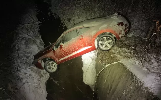 Accident Ends With Car Trapped Between Creek Banks